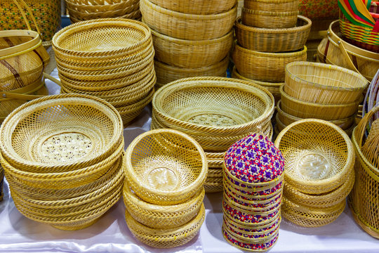 Close-up Community Products Weaving A Wicker Basket By Handmade, in a market of Thailand  