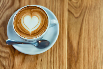 Cappuccino or Latte coffee art cup with heart shaped.