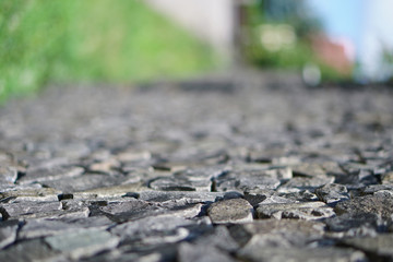 Blurred road of their stone and bruschatki. Background for tourist design.