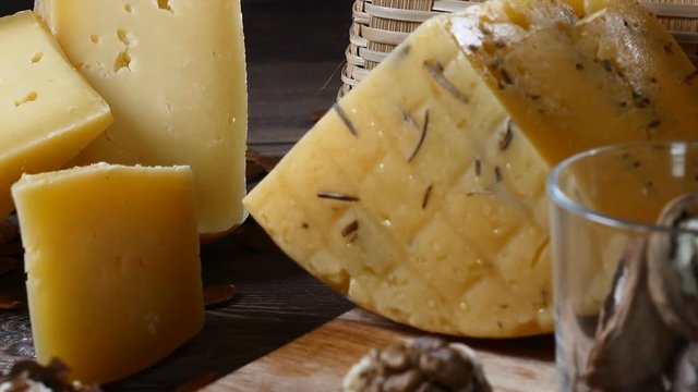Restaurant dish serving. Close up shot of cheese on wooden background.