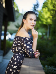 Outdoor atmospheric fashion photo of young beautiful lady