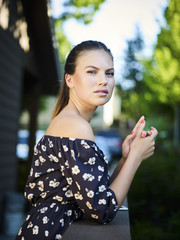 Outdoor atmospheric fashion photo of young beautiful lady