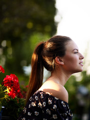 Outdoor atmospheric fashion photo of young beautiful lady