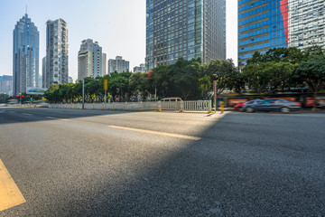 Obraz premium empty road and modern office block buildings against sky, china