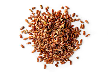 Macro image of red rice pile isolated at white background. Top view