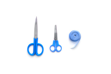 tools for creativity scissors ribbon textile blue on white background