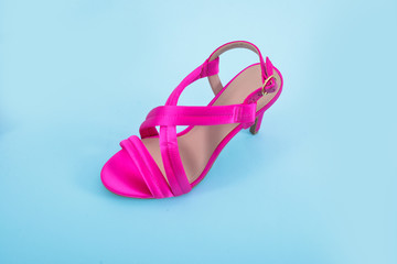 Female Pink shoes on light blue background