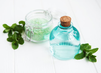 essential aroma oil with massage salt and mint