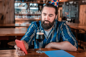 Middle age crisis. Mature handsome man feeling emotional while having some middle age crisis on his birthday