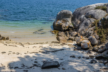 Fototapeta na wymiar rock in the water washed by sea water