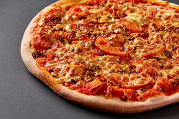 Hot pizza on black background for lunch or dinner crust. Pizza menu.