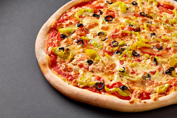 Hot pizza on black background for lunch or dinner crust. Pizza menu.