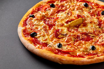 Hot pizza on black background for lunch or dinner crust. Pizza menu.