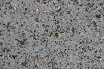 gray concrete with stones texture 