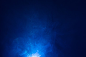 Fototapeta na wymiar beautiful blue color light beam at night . smoke texture spotlight . screening abstract background .