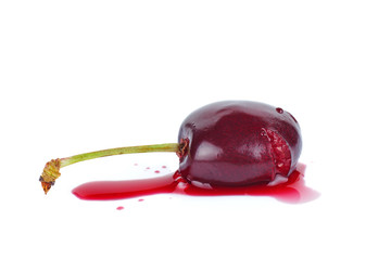 Crushed ripe cherry isolated on a white background