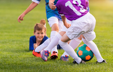 Young children players football match on soccer field