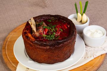 Traditional Borsch with meat in Bread