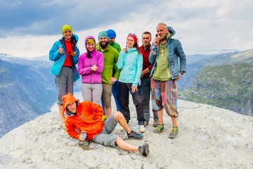Happy young sportive people group of eight in bright colorful sportswear have fun and enjoy fresh...