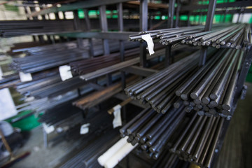 Stack of steel pipes in metal factory