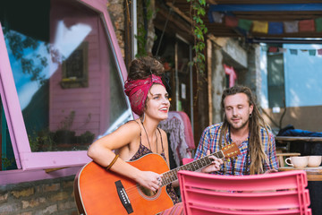 Favorite song. Blue-eyed female musician wearing red headband singing her favorite song her loving...