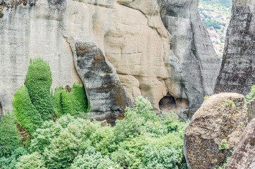Kalambaka, Greece - June 10, 2018: Cracks and dents on a huge wall around the complex Platis Litos Orthodox Monastery of Great Meteora 