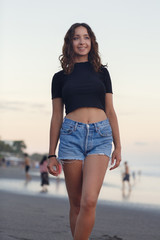 Happy Young Girl on the beach, looking away. Summer vacation lifestyle