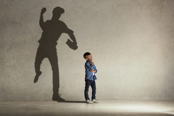 American baseball champion. Childhood and dream concept. Conceptual image with boy and shadow of...