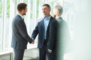 Business people shaking hands, finishing up a meetingHandshake Business concept