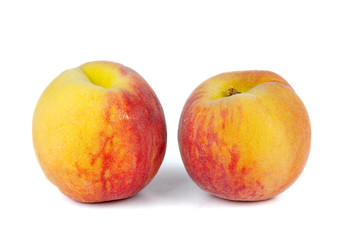 Pair of orange peaches