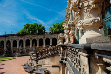 young beautiful girl in Dresden Zwinger in summertime.