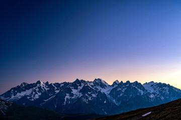 Scenic view of beautiful Swiss Alps mountains. Blue hour sunset with pink and blue tones, Verbier,...