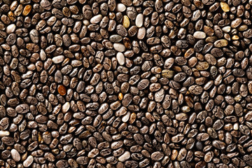 Top view image of black chia seeds super-food background. Natural vegan pattern.