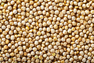 Quinoa grain top view background. Healthy super food pattern.