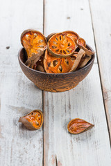 Dry Bael fruit - Slices of dry Bael fruit on the wooden table