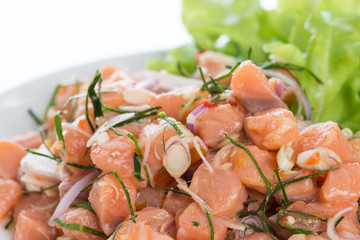 Salmon spicy salad with lemon grass isolated on white background
