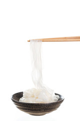 Rice flat noodles on white background