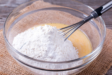 Making cookies. Pouring flour.