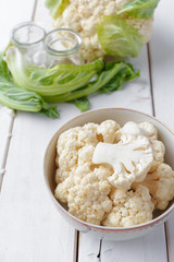 Organic cauliflower on wooden background