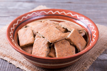 Cookies with poppy seeds on a baking sheet for baking in an oven