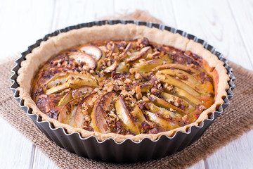 Homemade apple cake pie in form with fresh apples