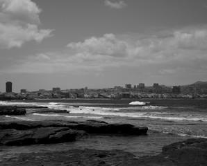 El Confital beach and Las Palmas city, monochrome effect, Canary Islands