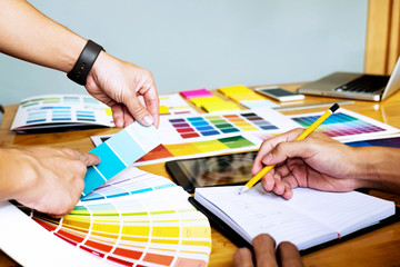 Graphic designers choose colors from the color bands samples for design .Designer graphic...