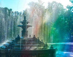 Fountain with colorful rainbow. Stefan cel Mare Central Park. Chisinau, Moldova