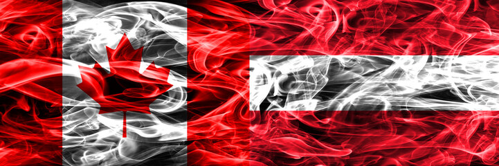 Canada vs Austria smoke flags placed side by side. Canadian and Austria flag together