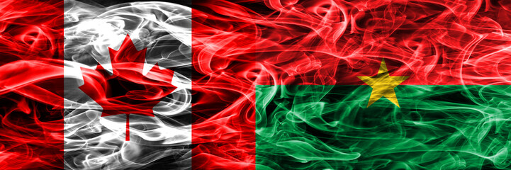 Canada vs Burkina Faso smoke flags placed side by side. Canadian and Burkina Faso flag together