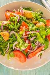 German food - a traditional vegetarian salad with potatoes, tomatoes, onions and arugula