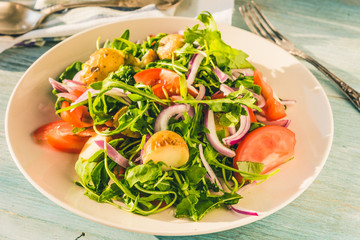 German food - a traditional vegetarian salad with potatoes, tomatoes, onions and arugula