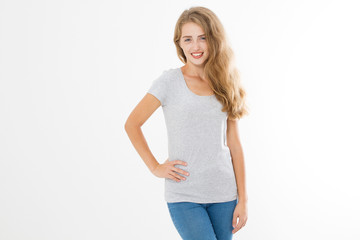 Obraz premium Young blonde woman with fit slim body in blank template t shirt and jeans isolated on white background. Skin and hair care. Copy space and mock up