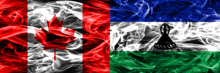 Canada vs Lesotho smoke flags placed side by side. Canadian and Lesotho flag together